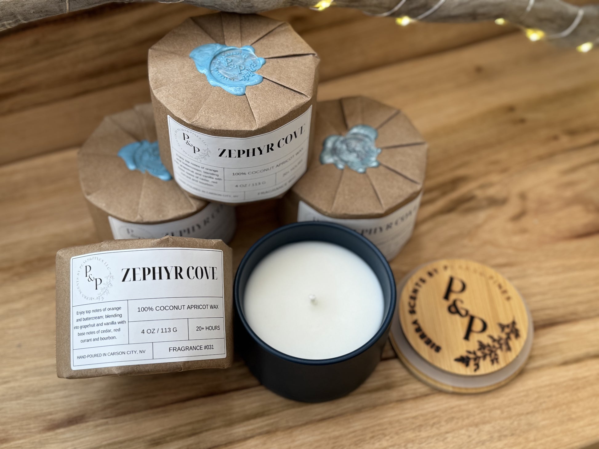  4 Wrapped Zephyr Cove 4 oz candles with wax seal, gift-ready packaging and 1
Zephyr Cove 4 oz candle unwrapped showing blue ceramic vessel and a branded wood lid.
