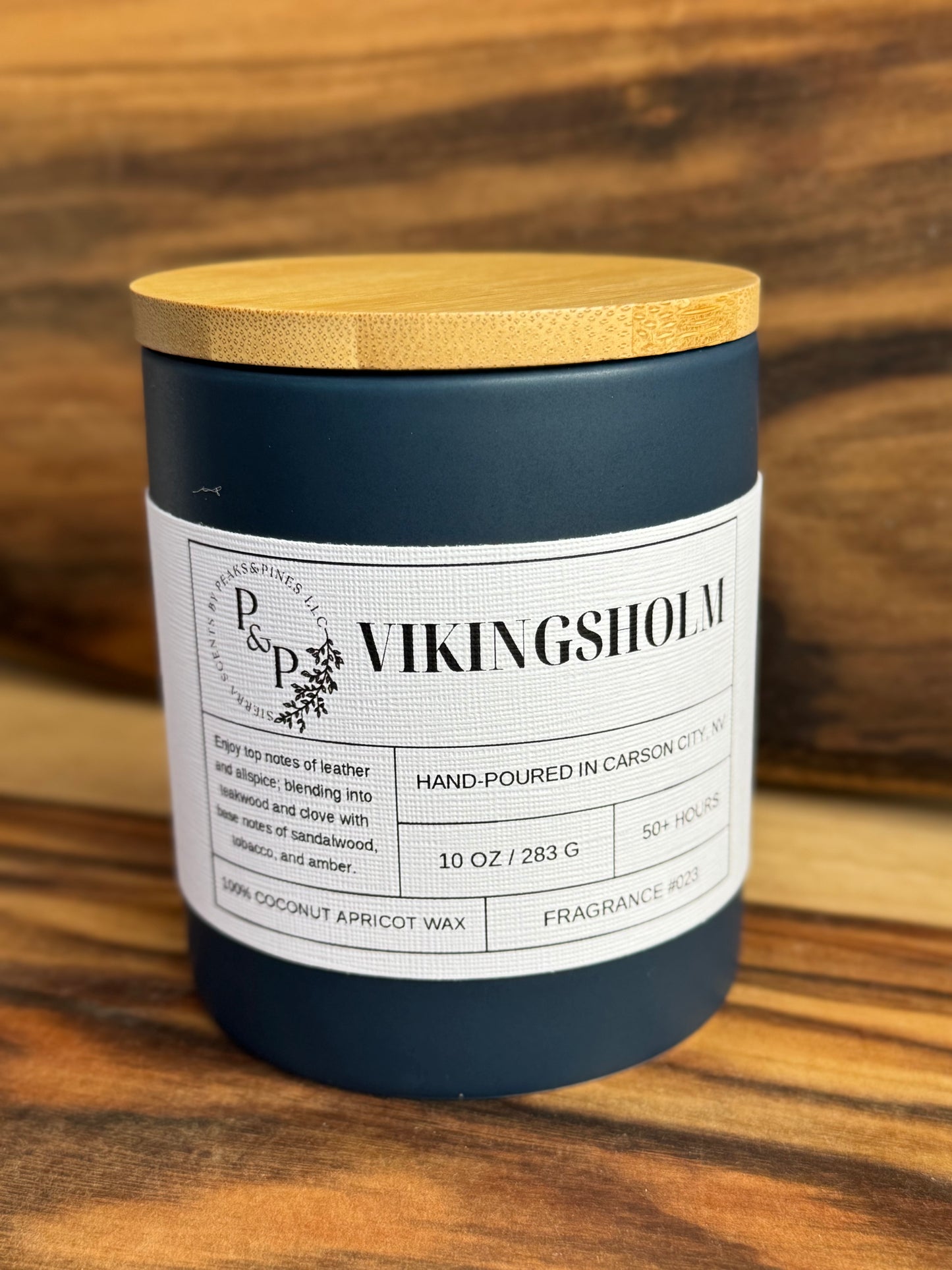 Vikingsholm 10 oz ceramic candle by Peaks and Pines, ceramic jar with wood lid and white label