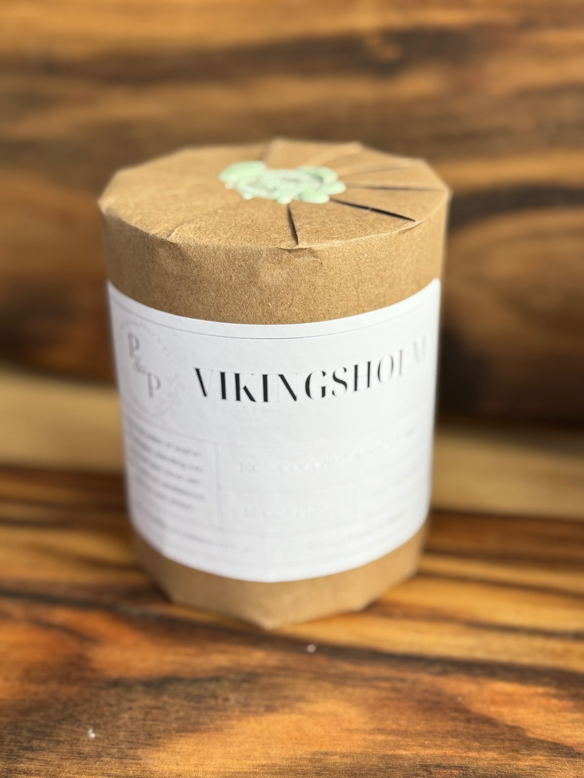 Wrapped Vikingsholm 10 oz ceramic candle by Peaks and Pines, with wax seal.