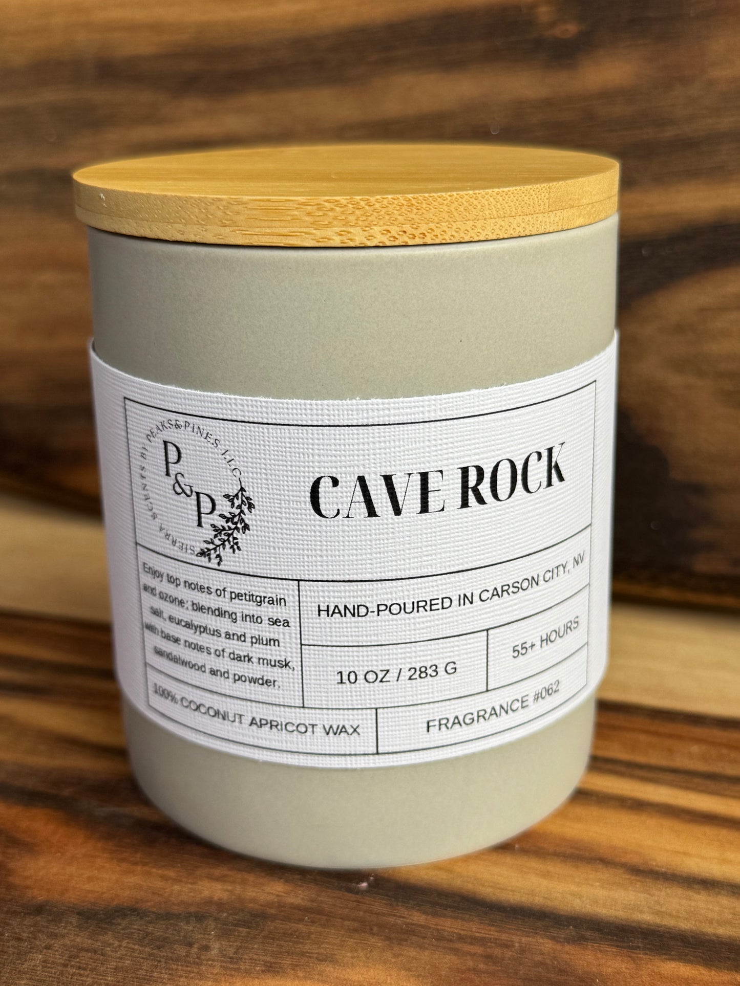 Cave Rock 10 oz ceramic candle by Peaks and Pines, ceramic jar with wood lid and white label