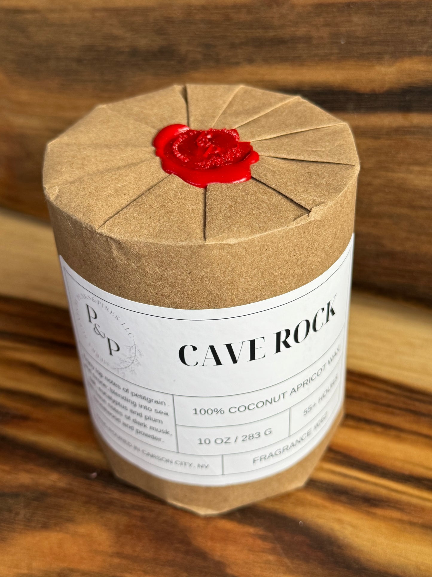 Wrapped Cave Rock 10 oz candle with wax seal, gift-ready packaging by Peaks and Pines