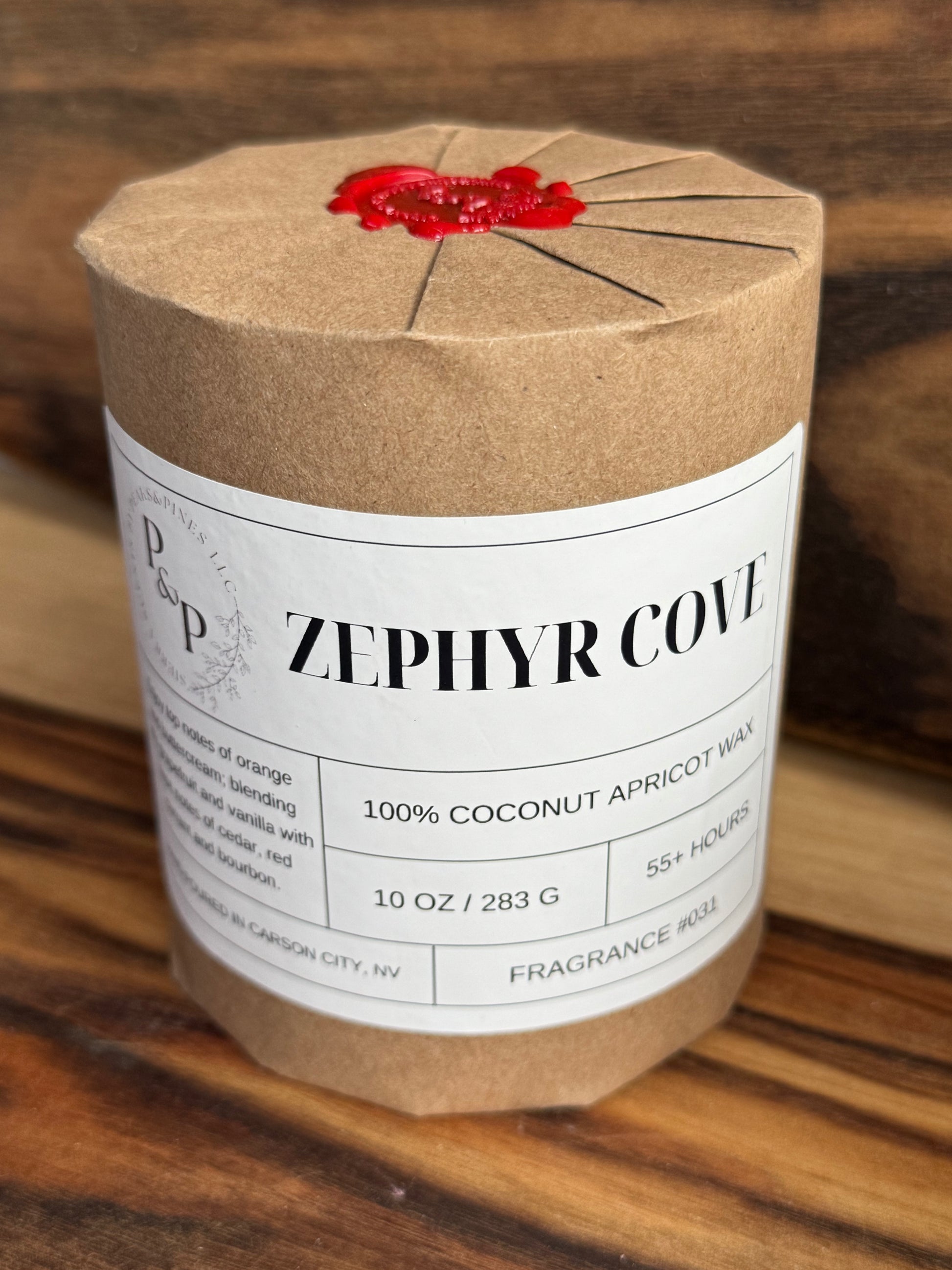 Wrapped Zephyr cove 10oz candle with red wax seal
