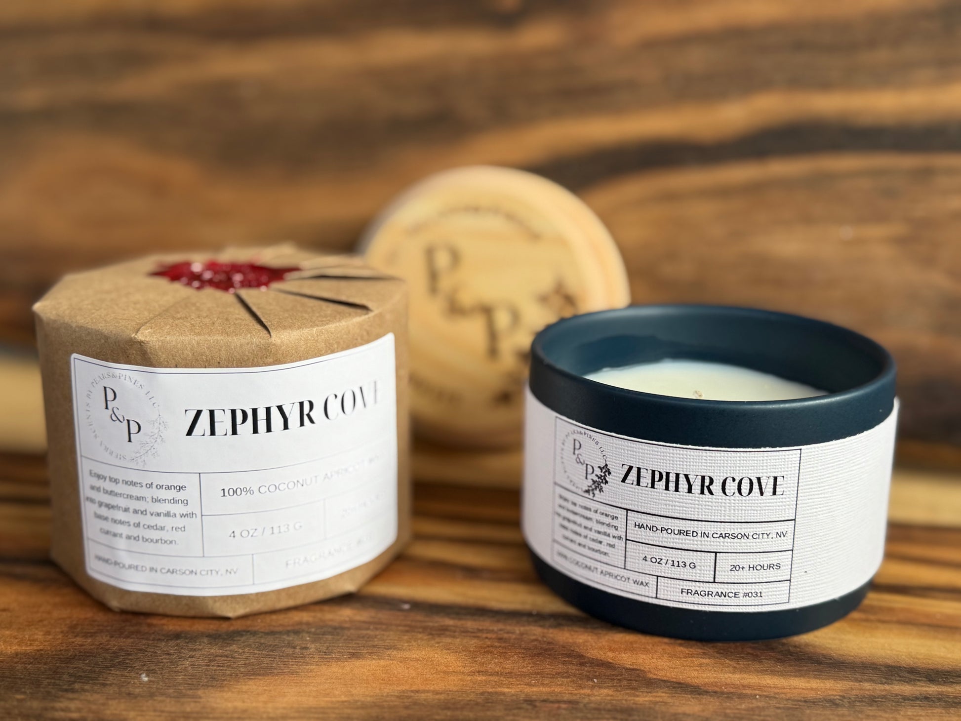 Two Zephyr Cove 4oz candles. One wrapped and one unwrapped showing blue ceramic vessel and white label. 