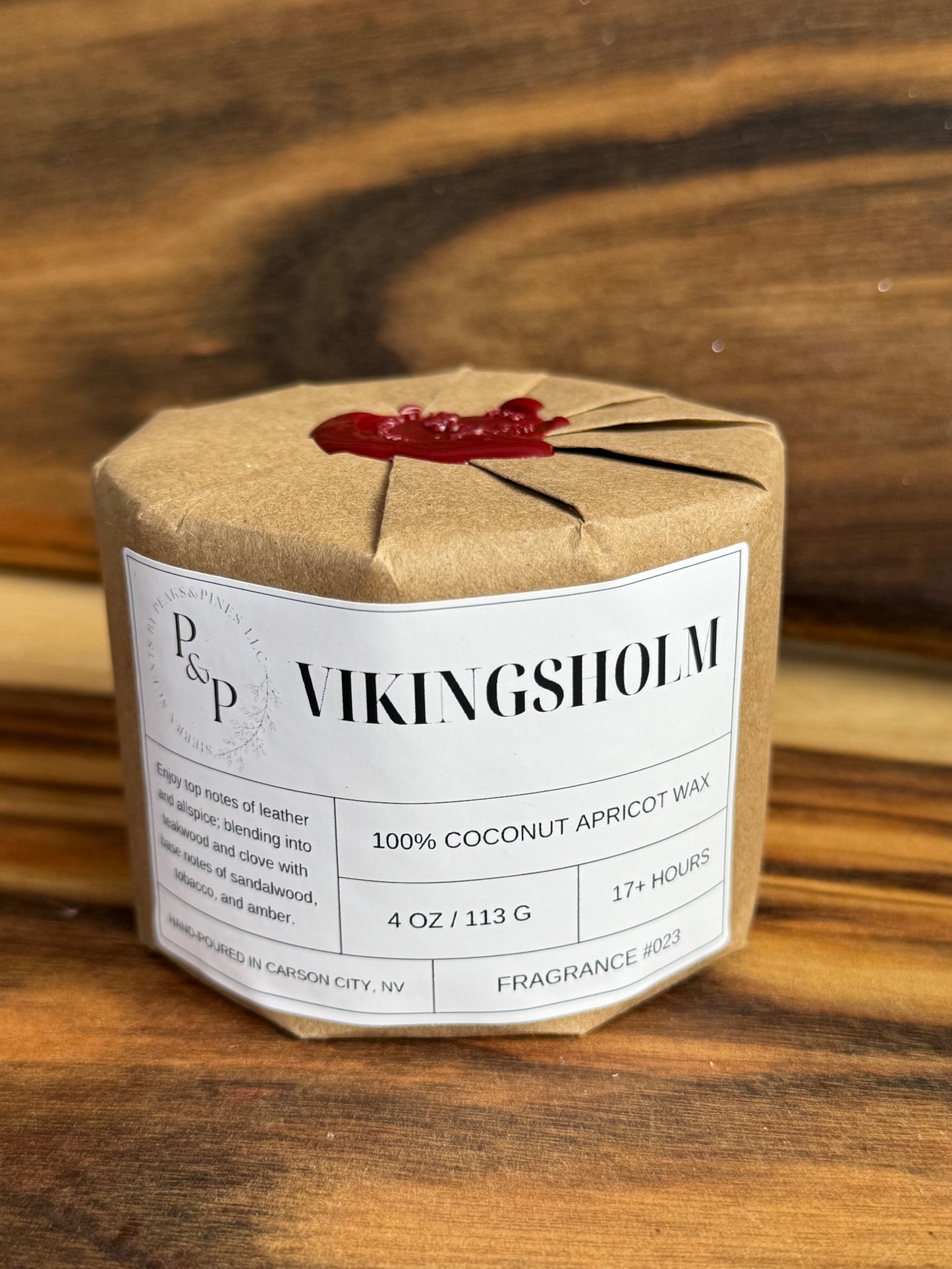 Wrapped Vikingsholm 4 oz candle with wax seal, gift-ready packaging by Peaks and Pines.