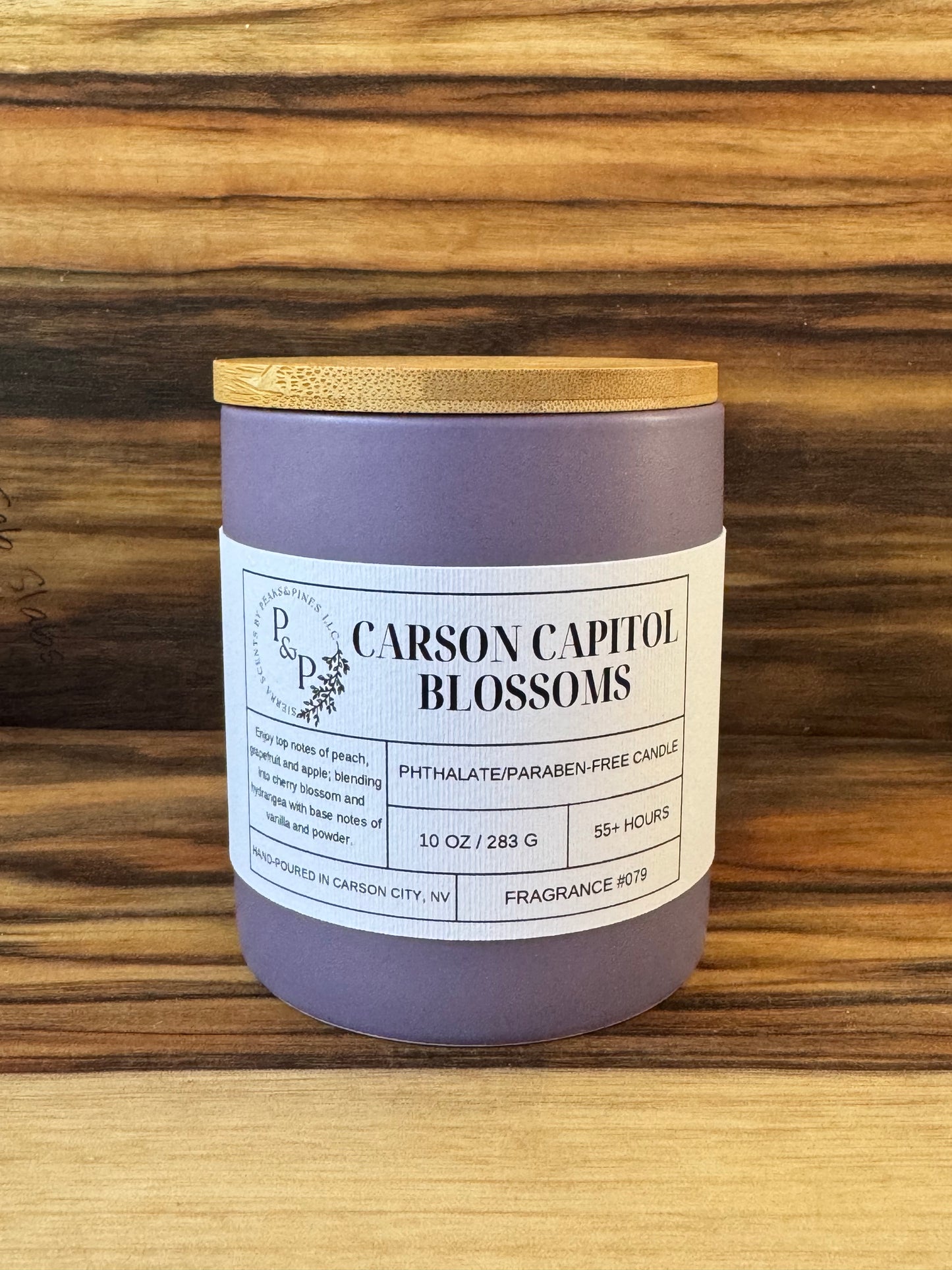 Carson Capitol Blossoms 10 oz purple ceramic candle by Peaks and Pines, wood lid and white label