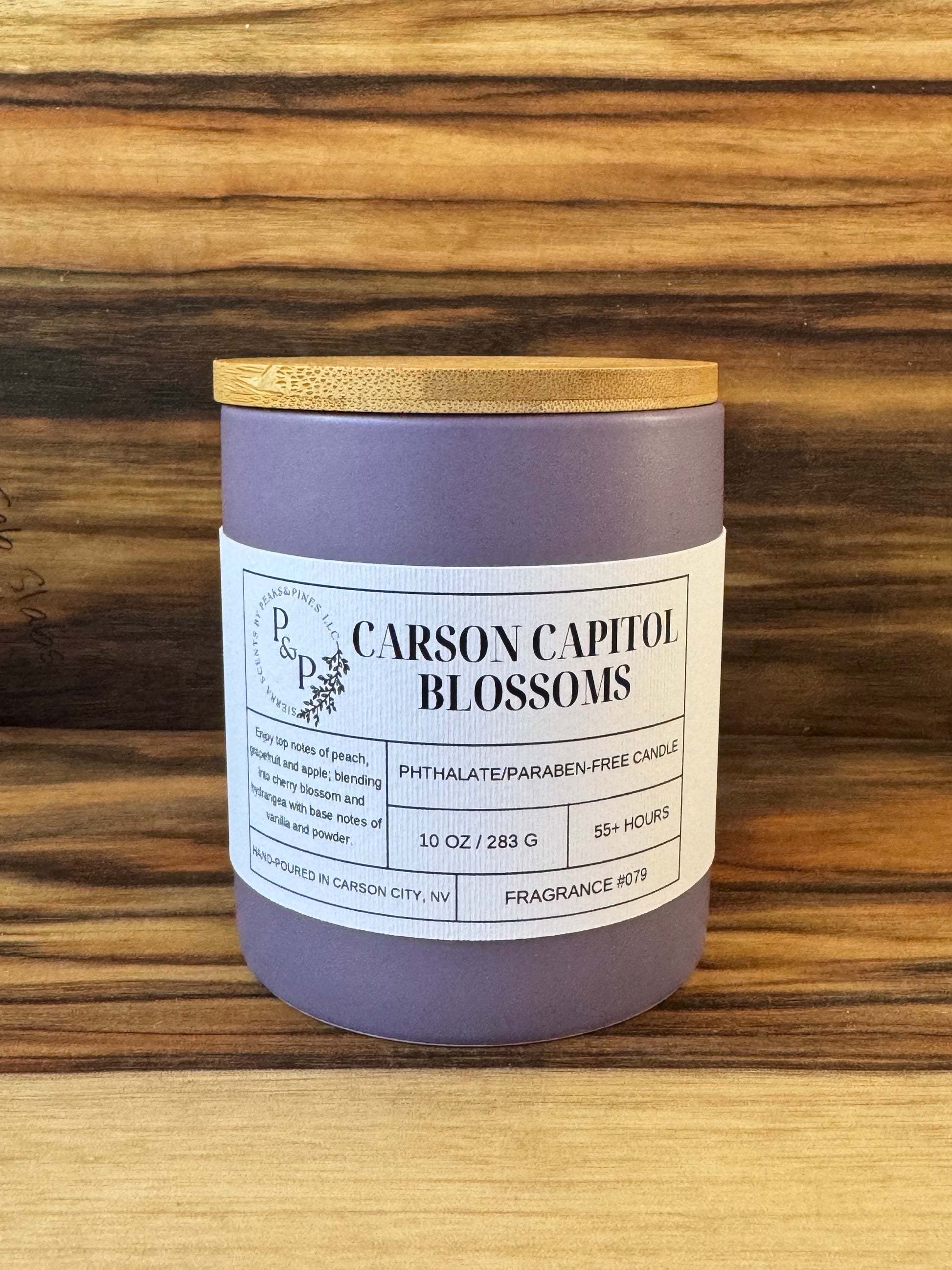 Carson Capitol Blossoms 10 oz purple ceramic candle by Peaks and Pines, wood lid and white label