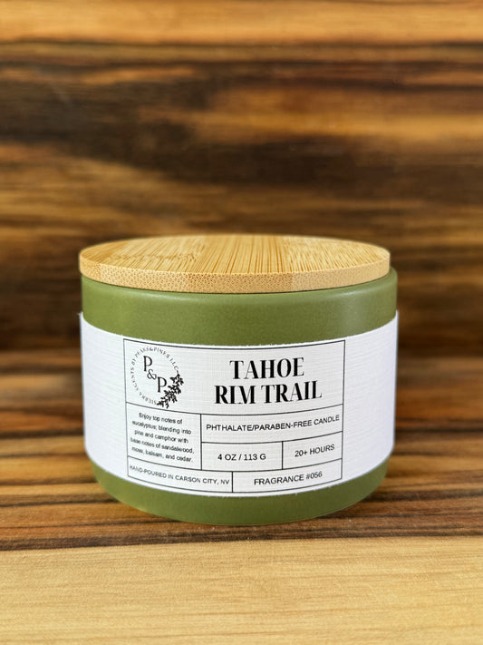 Tahoe Rim Trail 4 oz ceramic candle by Peaks and Pines, green ceramic jar with wood lid and white label.
