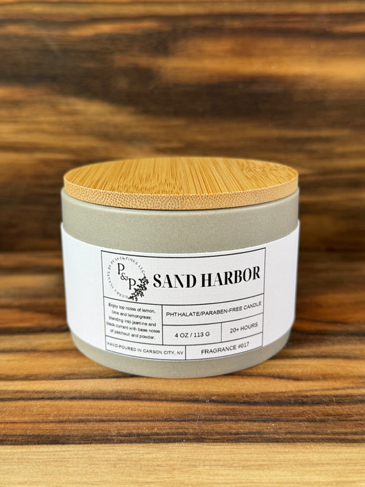 Sand Harbor 4 oz ceramic candle by Peaks and Pines, gray jar with wood lid and white label